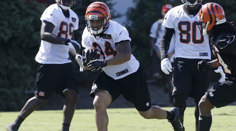 Cincinnati Bengals running back Daniel Herron (34) runs the ball during practice at the NFL football team's training camp, Thursday, July 25, 2013, in Cincinnati. (AP Photo/Al Behrman)