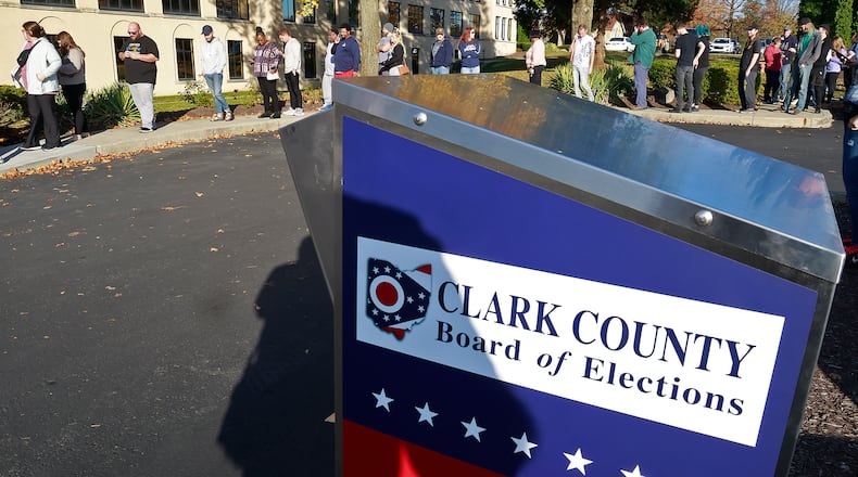 Clark County residents wait in a line that wraps around the parking lot at the Clark County Board of Elections to cast their vote on Sunday, Nov. 3, 2024, the last day of in-person early voting before the election. BILL LACKEY/STAFF