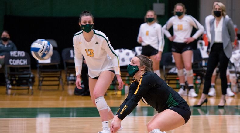 Wright State's Jenna Story prepares to bump the ball as teammate Callie Martin looks on during the Horizon League title match vs. UIC. Joseph Craven/Wright State Athletics