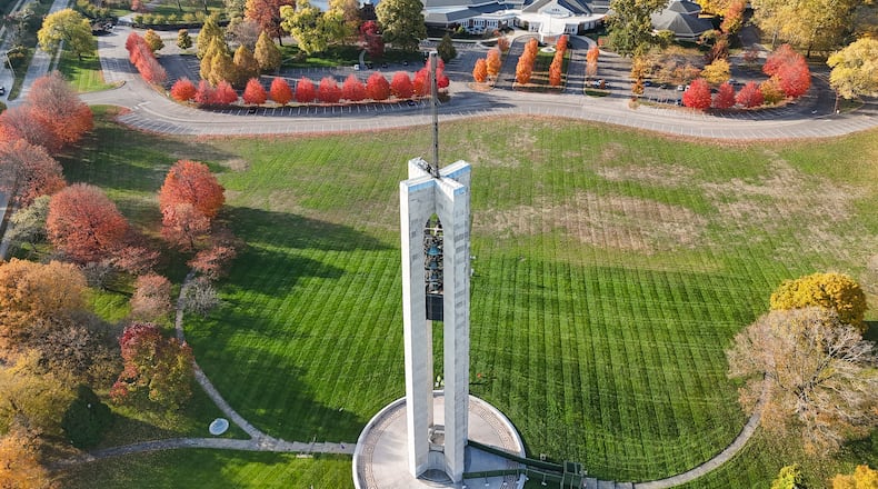 A crew from Wilcon Commercial Construction installs several miles of cable to string lights for the holiday season on the tower at Carillon Historical Park Wednesday, Nov. 5 in Dayton. The Christmas lights will be turned on Nov. 25. NICK GRAHAM/STAFF