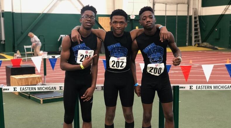 Qua’Lek Shelton, center, who died this week after being shot on Catalpa Drive on Sunday, was a national champion runner. He is pictured here with his relay teammates, at left, Mason Louis and a right, Daishuan Gossett. CONTRIBUTED