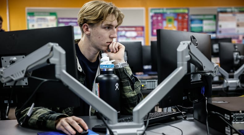 Beavercreek High School student Dylan Robinson studies in the district's new computer science career tech class Thursday November 21, 2024. JIM NOELKER/STAFF