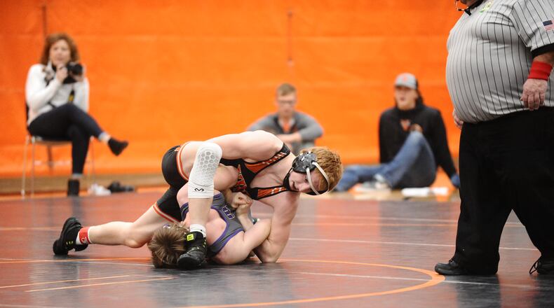 Versailles 160-pound junior Cael Bey (top) pinned Mechanicsburg freshman Adam Waller in 56 seconds during the championship match at the Division III, Region 24 dual team tournament Saturday in Coldwater. Greg Billing / Contributed