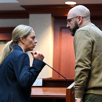 Former Lakota teacher Justin Daniel Dennis speaks with his attorney, Chelsea Panzeca, during an October 2025 court hearing before Butler County Common Pleas Judge Keith Spaeth. Dennis pleaded guilty Wednesday, Jan. 28, 2026, to three counts of sexual battery, all third-degree felonies. Five counts of the same were dismissed by the court. Dennis had an inappropriate relationship with a student when she was 17 during the 2021-2022 school year. STAFF FILE PHOTO