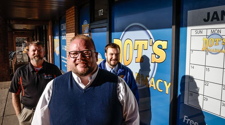 From left, Ken Fields, Kyle Fields and Dot's Market owner Nick Moshos plan to open a new pharmacy next to Dot's Market at Cross Pointe Shopping Center in Centerville. JIM NOELKER/STAFF