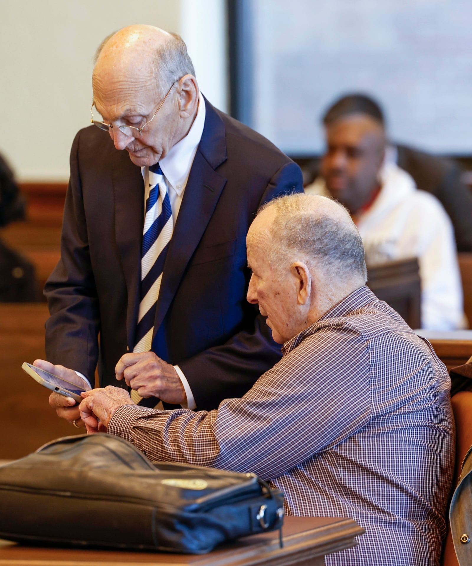 Attorney Jon H. Rion, left, and defendant William Brock review notes before opening arguments start in his murder trial. The 83-year-old is accused of fatally shooting Lo-Letha ÒLethaÓ Toland-Hall, a 61-year-old Uber driver in March 2024 because he reportedly believed she was trying to rob him after scammers deceived them. JOSEPH COOKE/STAFF