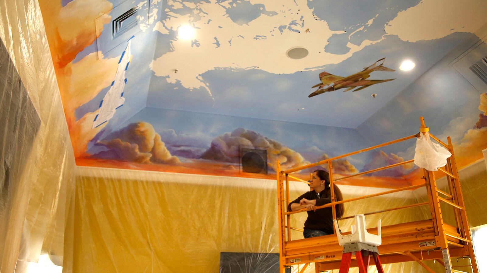 Mural by Jennifer Sayger inside the Frequent Flyer Hall at the new Flyboys Deli in Beaverceek.  TY GREENLEES / STAFF