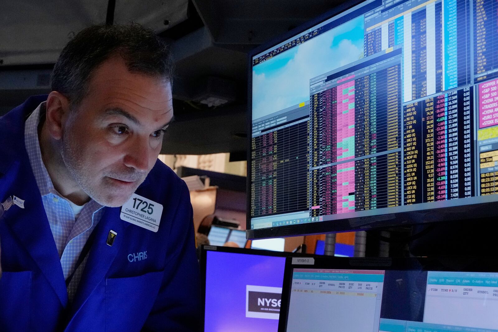 Trader Christopher Lagana works on the floor of the New York Stock Exchange, Friday, April 4, 2025. (AP Photo/Richard Drew)