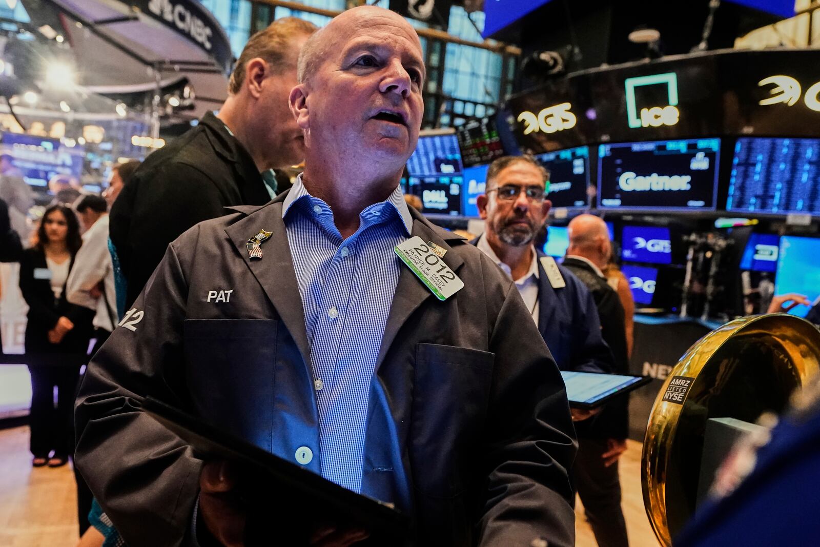 Trader Patrick Casey, left, works on the floor of the New York Stock Exchange, Monday, June 23, 2025. (AP Photo/Richard Drew)