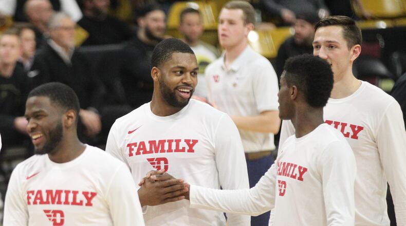 Dayton’s Trey Landers and Dwayne Cohill shake hands before a NIT game against Colorado on Tuesday, March 19, 2019, at the CU Events Center in Boulder, Colo. David Jablonski/Staff