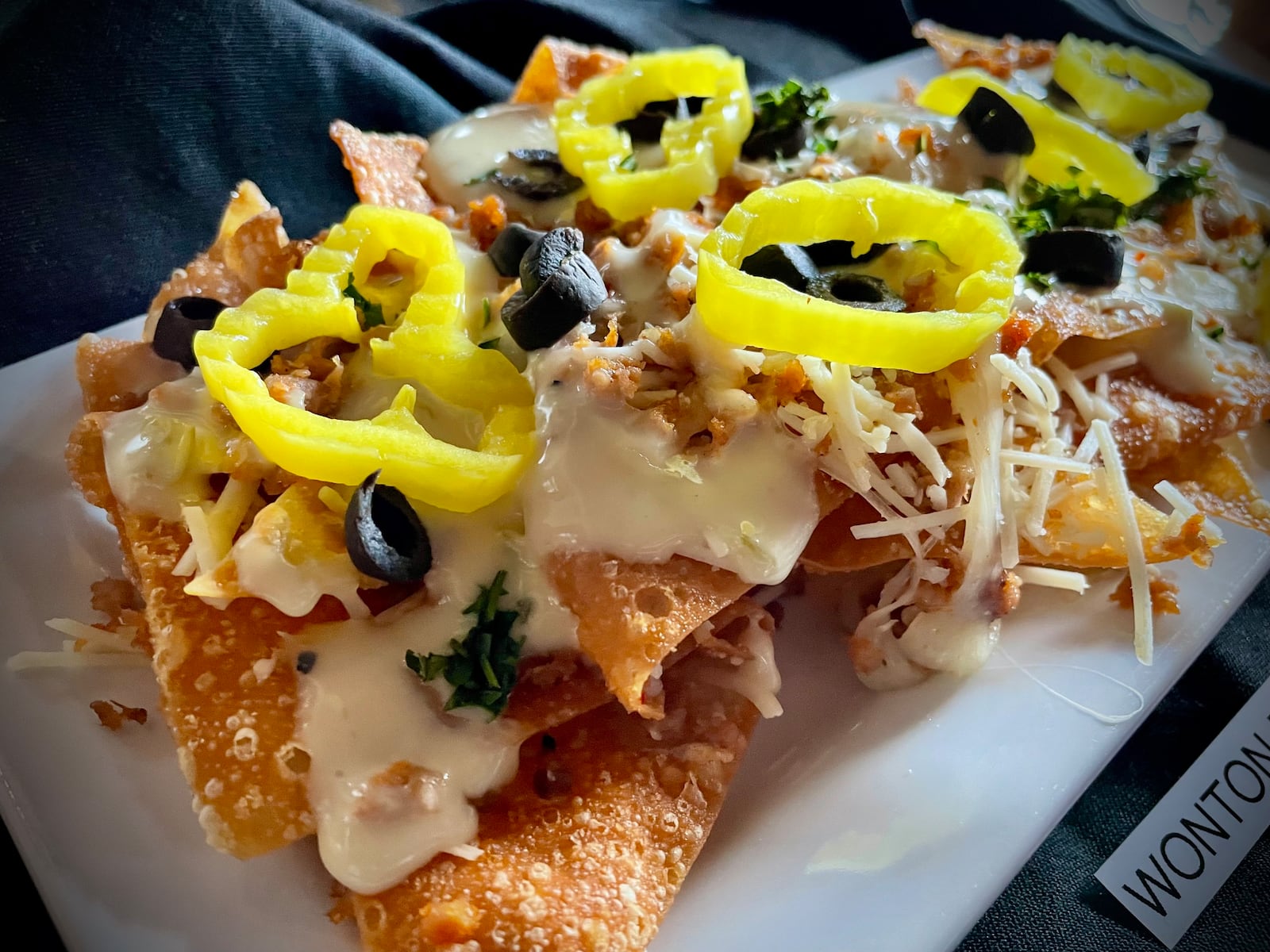 CMX CinéBistro at the Liberty Center has launched a new menu offering elevated theater food and snacks. Pictured is the wonton bistro nachos. NATALIE JONES/STAFF