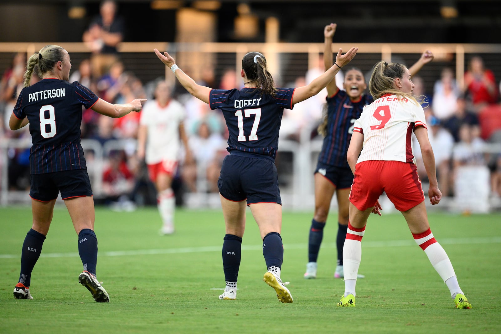 United States forward Sam Coffey (17) celebrates her goal with forward Avery Patterson (8) and others during the first half of an international friendly soccer match against Canada, Wednesday, July 2, 2025, in Washington. (AP Photo/Nick Wass)