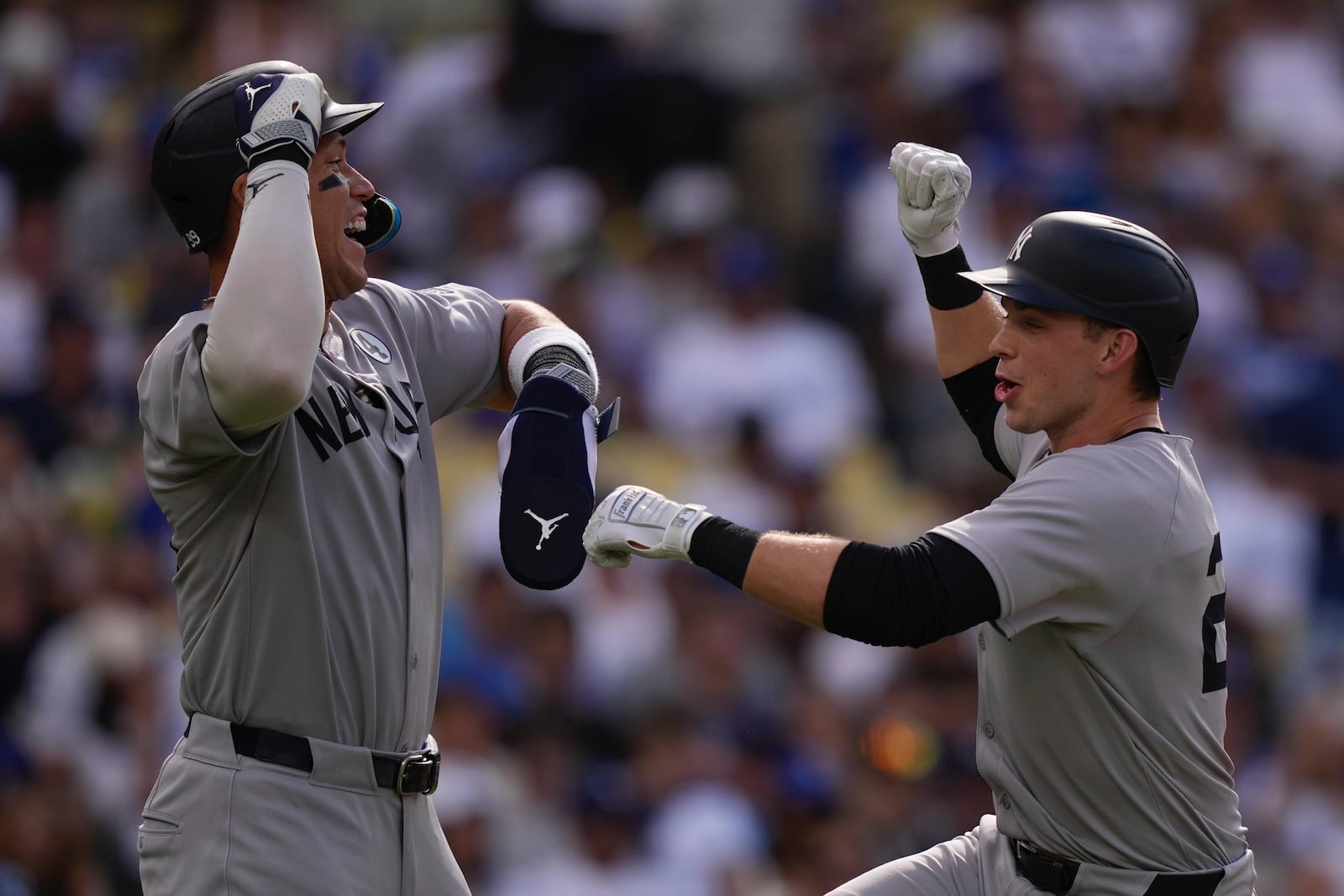 New York Yankees' Ben Rice, right, is congratulated by Aaron Judge after hitting a two-run home run during the third inning of a baseball game against the Los Angeles Dodgers, Sunday, June 1, 2025, in Los Angeles. (AP Photo/Mark J. Terrill)