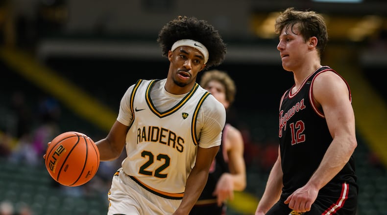 Wright State University's TJ Burch drives past IU Indy's Kyler D'Augustino during their Horizon League game on Thursday, Feb. 19, 2026 at the Nutter Center. The Raiders won 85-73. JEREMY MILLER / CONTRIBUTED PHOTO