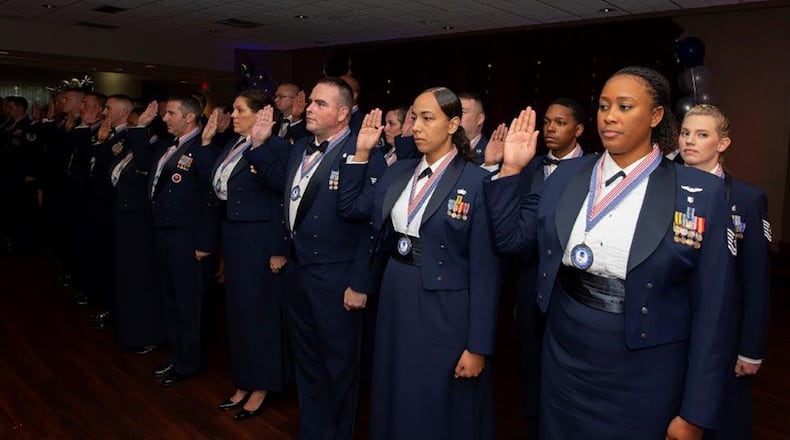 More than 30 new Air Force master sergeants and master sergeant selectees take the “Senior NCO Charge” during their induction ceremony Aug. 26 at Wright-Patterson Air Force Base. U.S. AIR FORCE PHOTO/R.J. ORIEZ