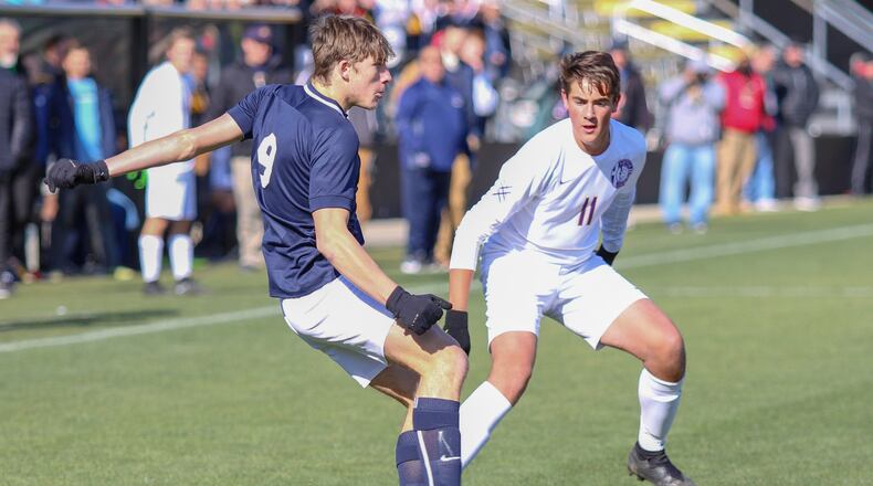 Dayton Christian’s Andrew Gottron pressures Archbold’s Elijah Zimmerman defender during the Division III state final on Saturday afternoon at MAPFRE Stadium in Columbus. The Blue Streaks won 2-1. CONTRIBUTED PHOTO BY MICHAEL COOPER