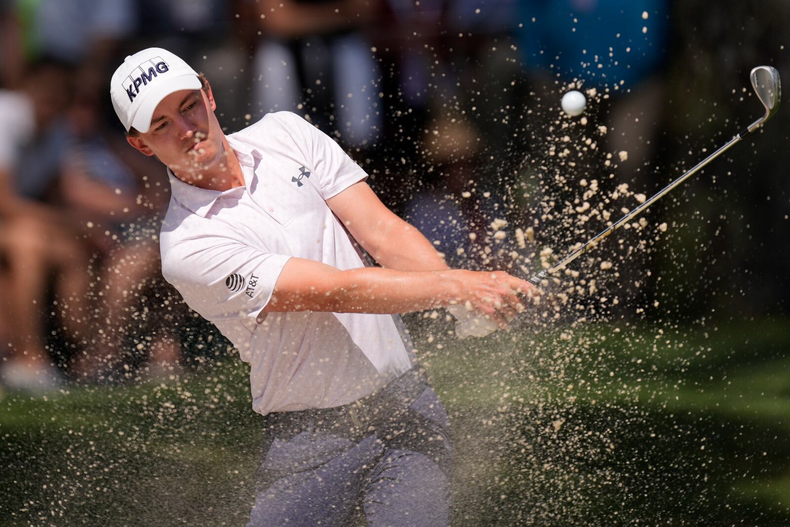 Maverick McNealy hits out of the bunker on the seventh hole during the final round of the RBC Heritage golf tournament, Sunday, April 20, 2025, in Hilton Head Island, S.C. (AP Photo/Mike Stewart)