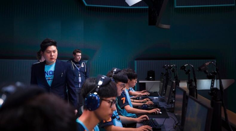 HOLD FOR USE WITH STORY MOVING OVERNIGHT WED. JAN.10, 2018-In this Dec. 7, 2017 photo provided by Blizzard Entertainment several members of the London Spitfire esports team compete in a preseason match in the Overwatch League at Blizzard Arena in Burbank, Calif. The new Overwatch League is a well-funded attempt to combine cutting-edge esports competition with a traditional sports league structure. (Robert Paul/ Blizzard Entertainment)