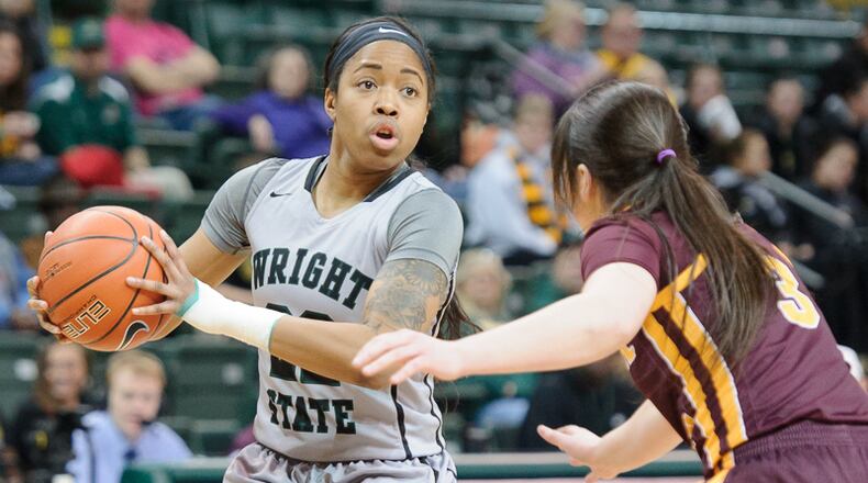 Wright State junior guard Chelsea Welch looks to pass with pressure from Central Michigan’s Presley Hudson during a WNIT game last season at the Nutter Center. Contributed Photo / Bryant Billing