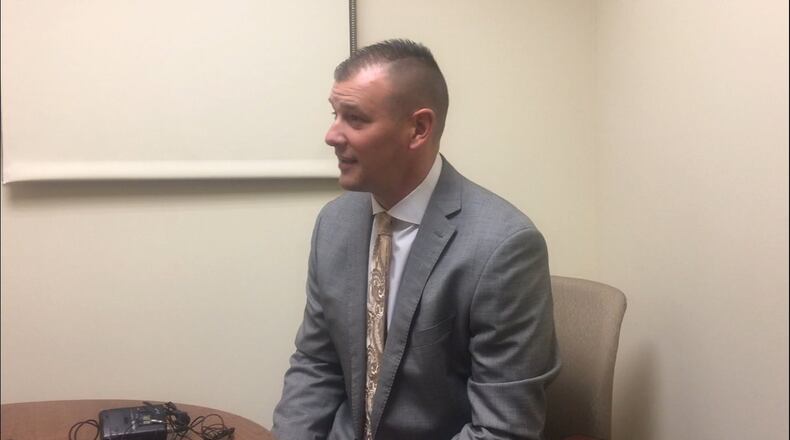 Brock Schoenlein, the attorney for the Dunbar football player who allegedly head-butted an official during a game in August, says it’s unclear to him whether his client has been properly charged. STAFF