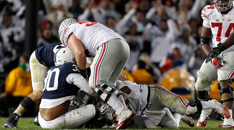 STATE COLLEGE, PA - OCTOBER 22: Kevin Givens #30 of the Penn State Nittany Lions sacks J.T. Barrett #16 of the Ohio State Buckeyes late in the fourth quarter during the game on October 22, 2016 at Beaver Stadium in State College, Pennsylvania. (Photo by Justin K. Aller/Getty Images)