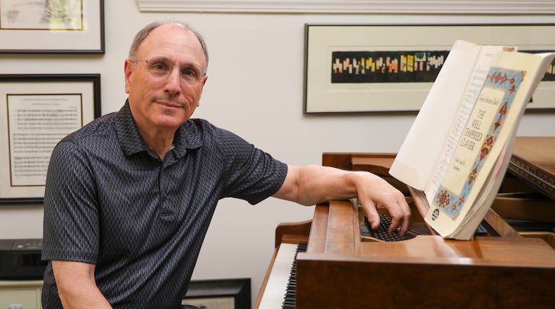 Neal Gittleman, who has served as Dayton Philharmonic Orchestra artistic director and conductor since 1995, is retiring. BRYANT BILLING / STAFF