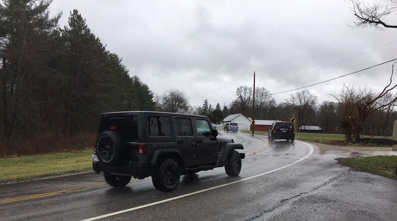 A plan by Oberer Homes for a residential development must accommodate a long-standing plan to straighten the 90-degree turn at Wilmington Pike and Conference Road. RICHARD WILSON/STAFF