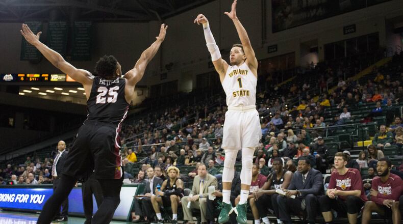 Raiders guard Justin Mitchell shoots a jump shot over IUPUI guard Ron Patterson during their Horizon League game at Nutter Center on Saturday, Dec. 30, 2017. WSU won 60-52 to finish 2017 with a 10-5 record. ALLISON RODRIGUEZ
