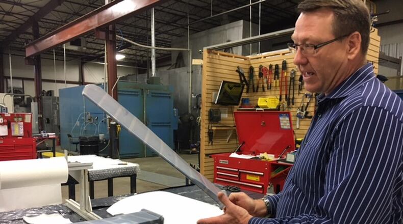 Craig Jennings, president of Spintech in Xenia, talks about this company’s “shape memory” polymer material. THOMAS GNAU/STAFF