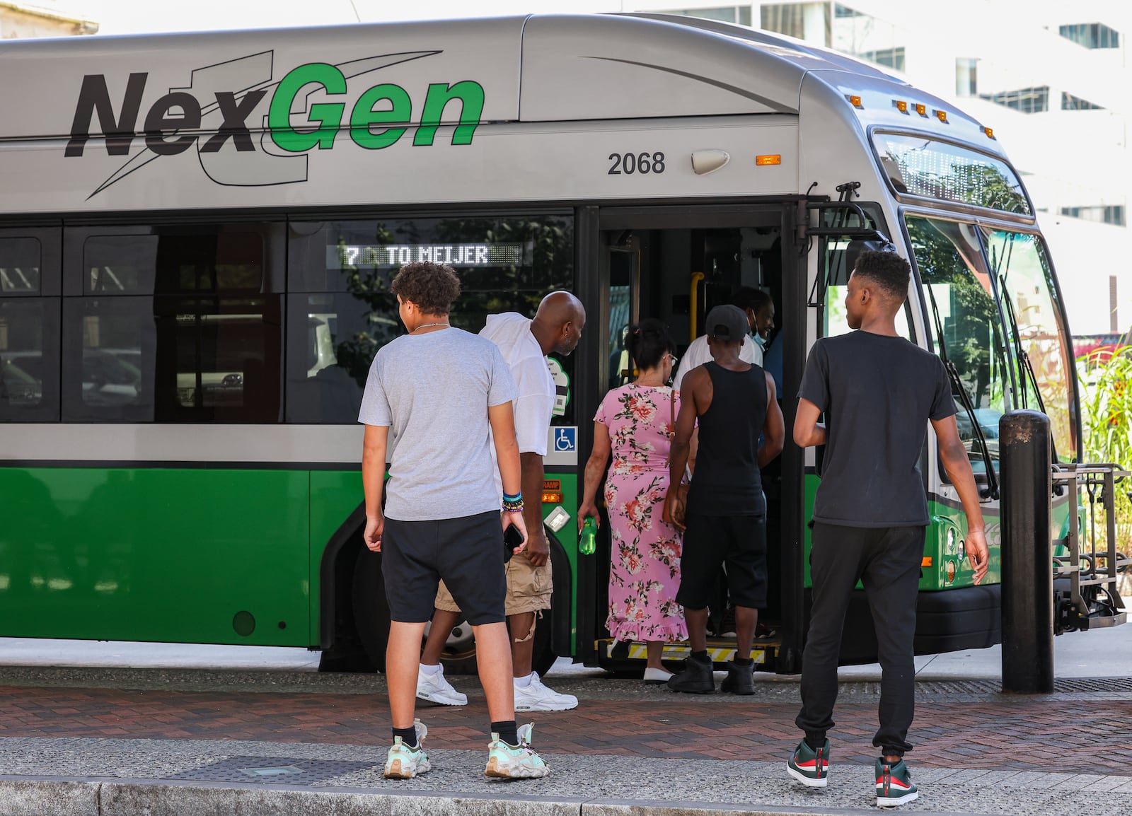 Passengers enter a Greater Dayton RTA bus at Wright Stop Plaza Transit Center on Friday, June 27. Dayton Public Schools may not offer transportation options to students if a locally backed provision in the state’s recently passed budget becomes law, but there are still options according to Board of Education member Jocelyn Rhynard. BRYANT BILLING / STAFF