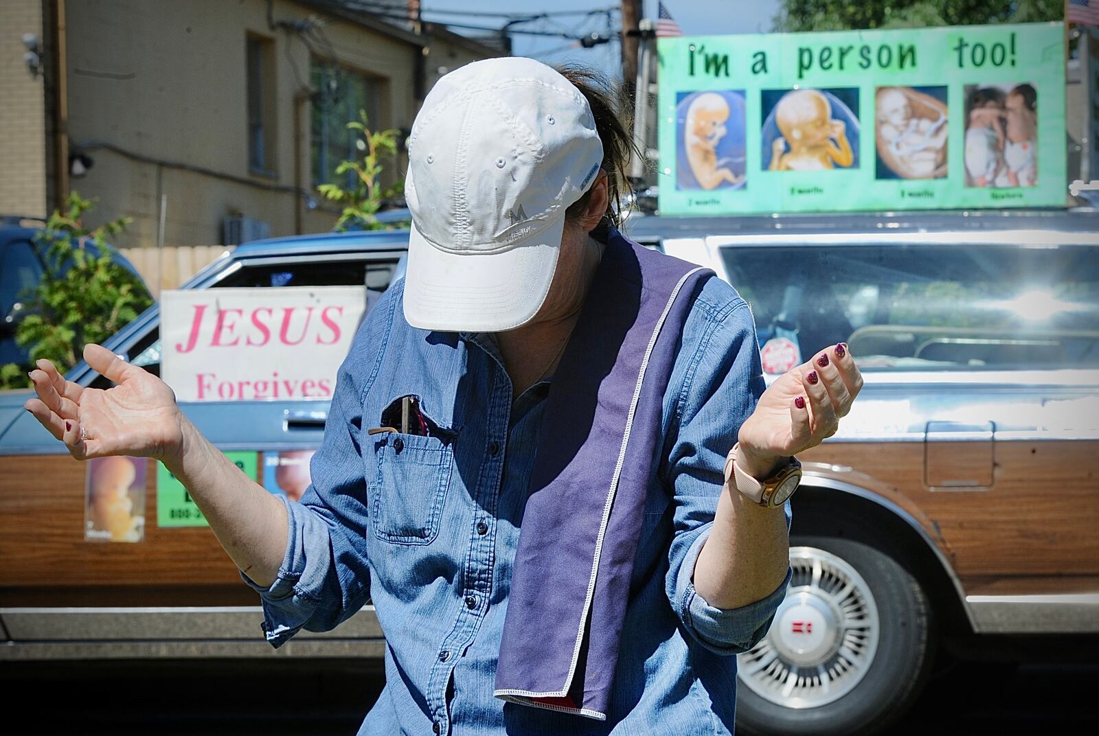 A woman prays outside of the Woman’s Med Center in Kettering Friday June 23, 2022. MARSHALL GORBY \STAFF