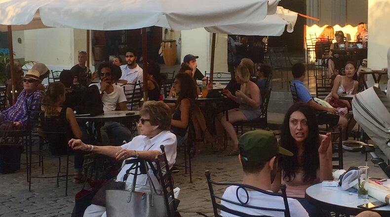 International visitors crowd Havana's Plaza de Armas in January 2017. (Mimi Whitefield/Miami Herald/TNS)