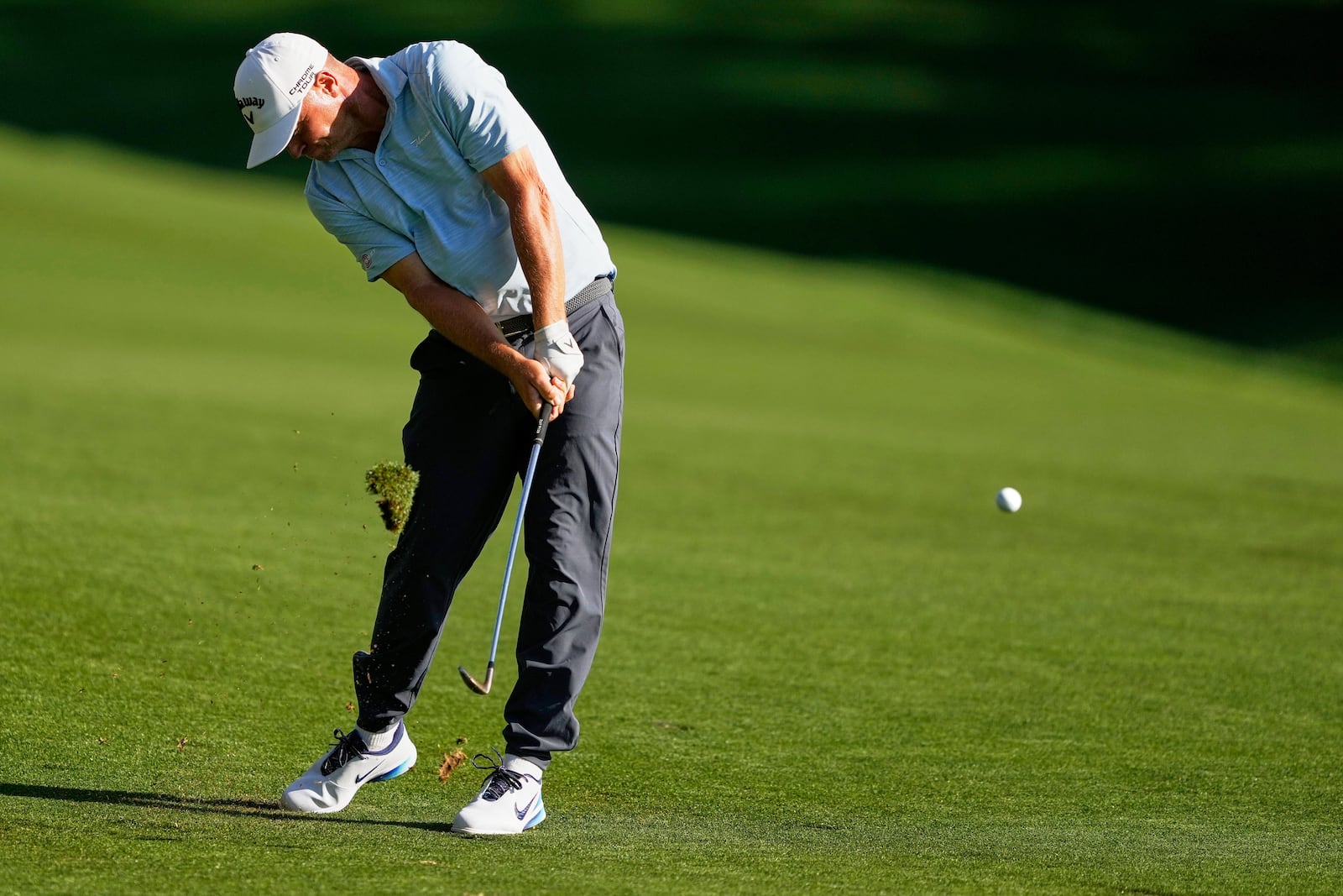 Alex Noren, of Sweden, hits from the fairway on the 18th hole during the third round of the PGA Championship golf tournament at the Quail Hollow Club, Saturday, May 17, 2025, in Charlotte, N.C. (AP Photo/Matt York)