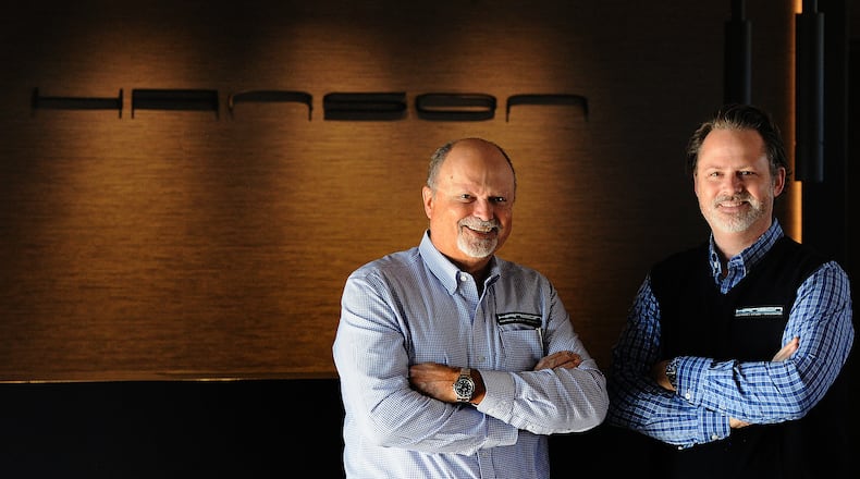 Greg Hanson, left, and Troy Hanson, owners of Hanson Audio Video, at their new, multi-story 6,405-square-foot showroom at 5749 Far Hills Ave. in Washington Twp. MARSHALL GORBY\STAFF
