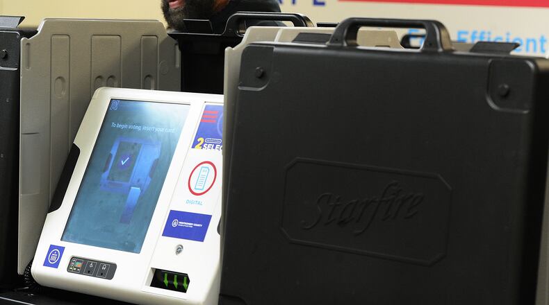 Brian Faggett Sr. votes Wednesday Oct. 12, 2022 at the Montgomery County Board of Elections. Early voting started Wednesday in Ohio. Election officials expect a large turnout of early voters this year. MARSHALL GORBY\STAFF