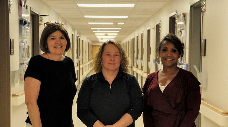 Left to right: Jennifer Grove, Wendy Croft and Jane Esprit were all diagnosed and treated for breast cancer and had breast reconstruction at Wright-Patterson Air Force Base’s Medical Center using their own tissues. The medical center’s plastic surgery clinic provides patients the full spectrum of reconstruction, from implants to tissue-based options, so that women have the opportunity to decide which options are best for them. (U.S. Air Force photo/Karina Brady)