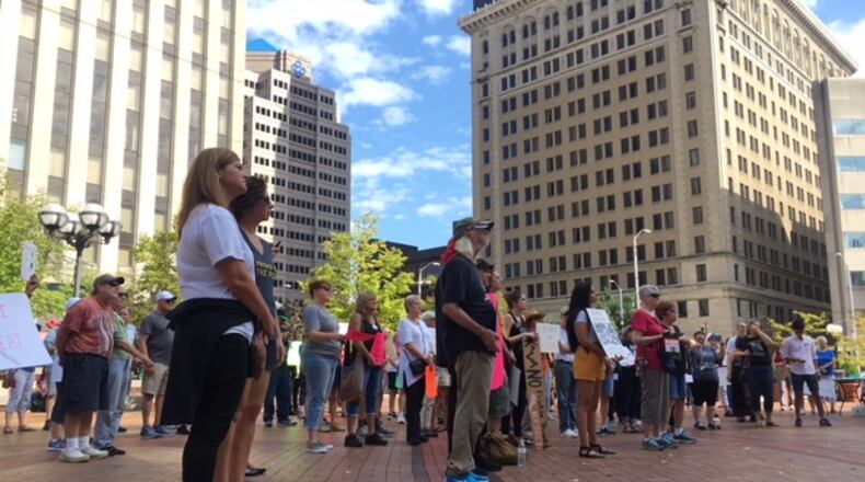 Several dozen protesters gathered in Courthouse Square in downtown Dayton on Saturday, Oct. 6, 2018, ahead of the successful Senate vote to confirm Associate Supreme Court Justice Brett Kavanaugh to the Supreme Court. WILL GARBE / STAFF