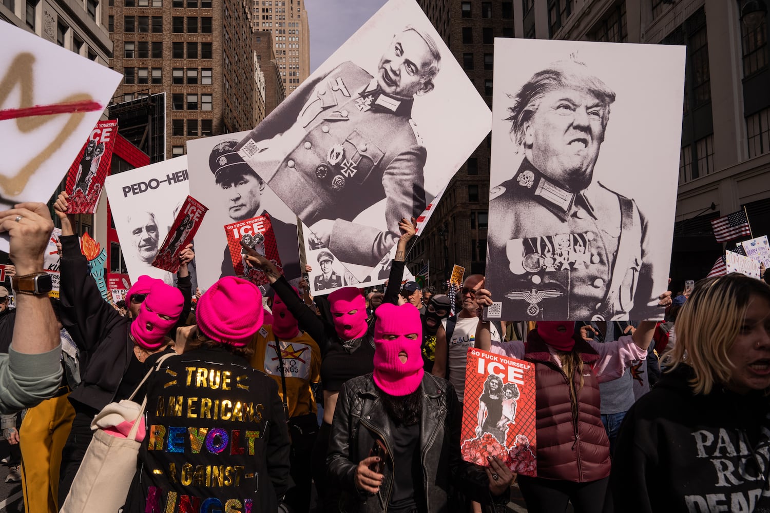 People dressed as Pussy Riot march down the streets of Manhattan during a No Kings Day protest on Saturday, Oct. 18, 2025z. (Adam Gray/The New York Times)