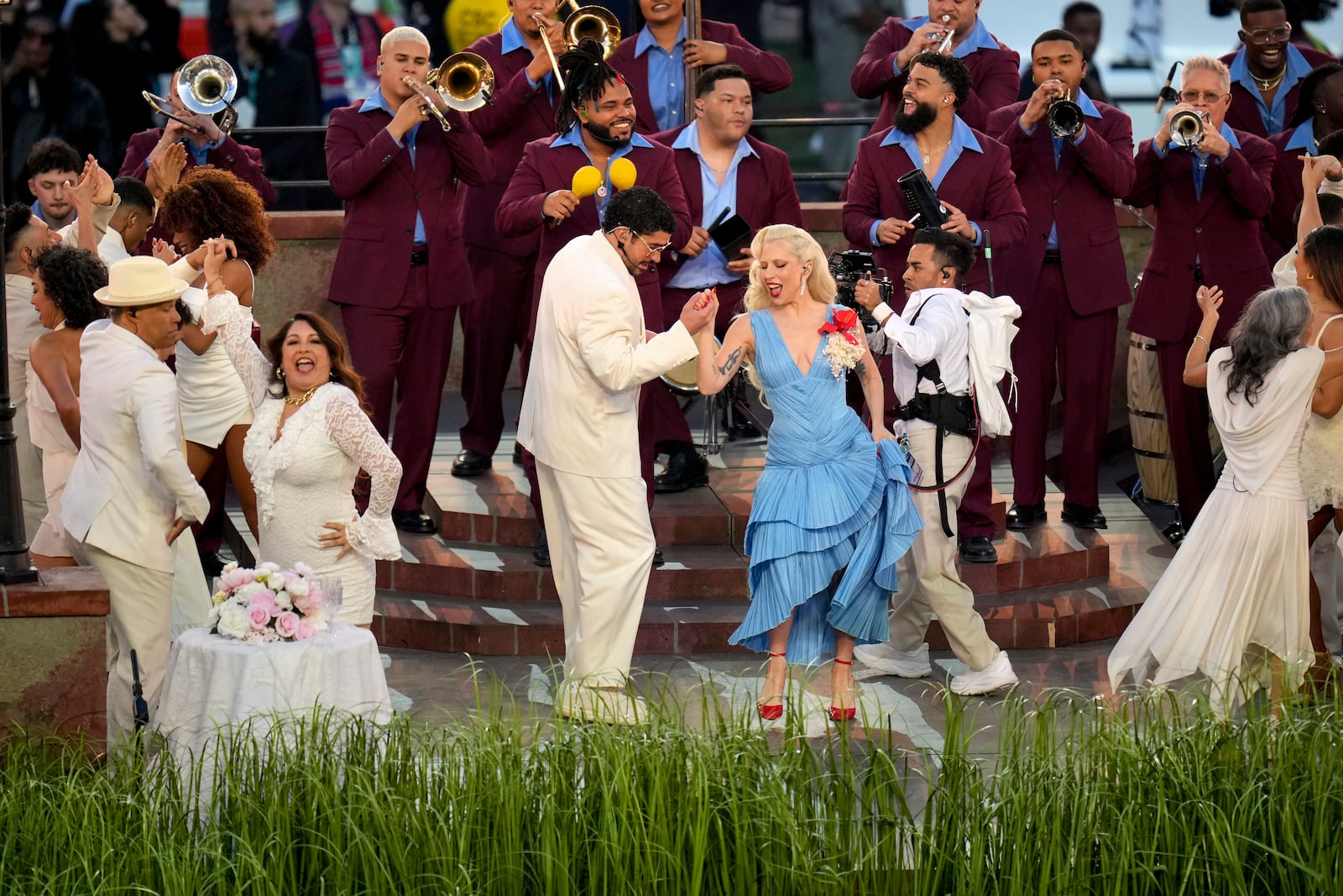 Bad Bunny performs with Lady Gaga, who provided the soundtrack to the (real) onstage wedding, singing a solo version of her Bruno Mars duet, “Die With a Smile,” backed by Los Sobrinos, at the halftime of Super Bowl LX at Levi’s Stadium in Santa Clara, Calif., Feb. 8, 2026. Bad Bunny showcased Puerto Rican pride during a 13-minute set that turned a global opportunity into an intimate, personal performance, wrote the New York Times pop music critic Jon Caramanica. (Loren Elliott/The New York Times)