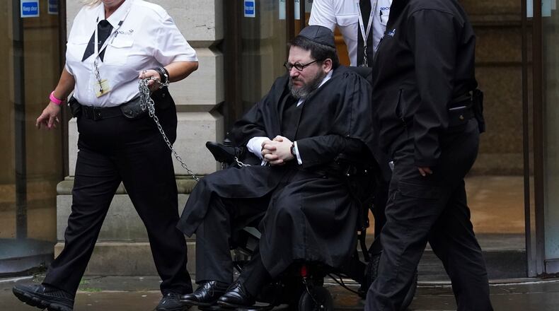 Nicholas Rossi leaves Edinburgh Sheriff and Justice of the Peace Court after an extradition hearing, in Edinburgh, Tuesday, June 27, 2023. Rossi has been fighting extradition to the United States to escape charges of identity theft, fraud and a sexual assault charge in Utah. (Andrew Milligan/PA via AP)