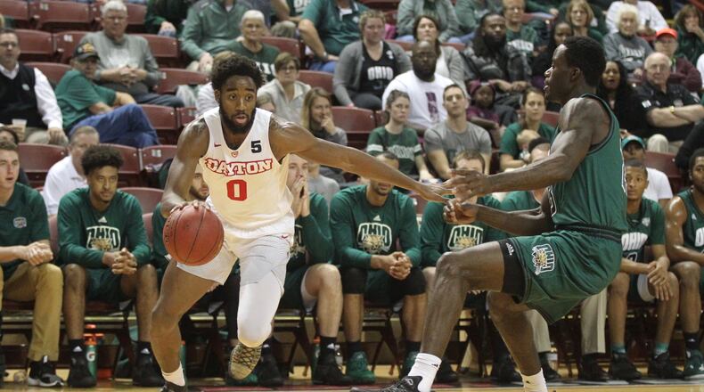Dayton’s Josh Cunningham drives to the basket against Ohio on Friday, Nov. 17, 2017, at TD Arena in Charleston, S.C.
