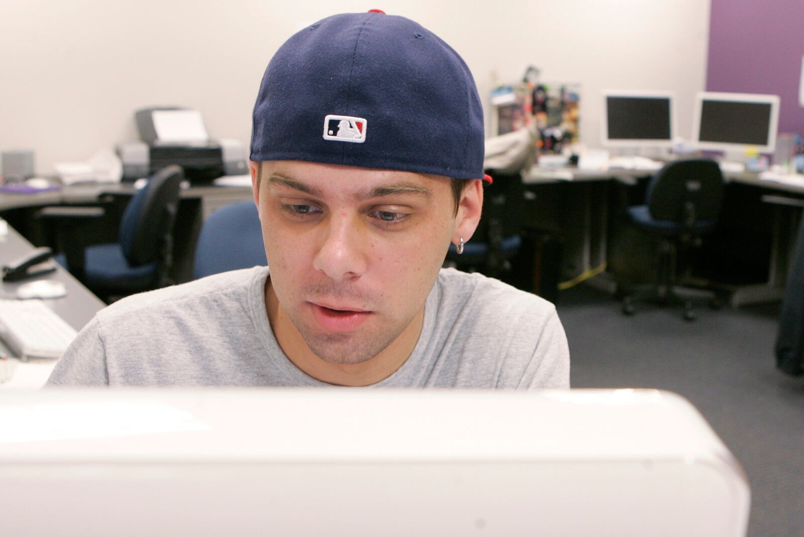 22 April 09. Andy Sedlak, , a sports writer with the Wright State University Guardian, the campus newspaper, researches a story while in the Guardian newsroom.