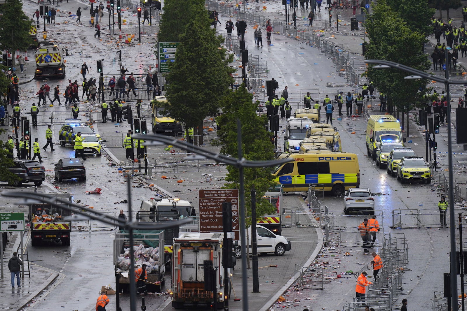 Police and emergency personnel deal with a road traffic accident on Water Street near the Liver Building in Liverpool after a car collided with pedestrians during the Premier League winners parade, in Liverpool, England, Monday May 26, 2025. (Danny Lawson/PA via AP)