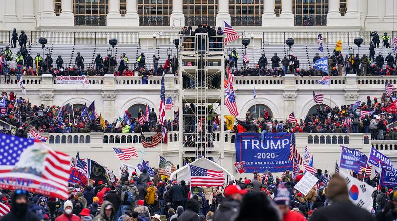 FILE - Insurrectionists loyal to President Donald Trump breach the Capitol in Washington, Jan. 6, 2021. (AP Photo/John Minchillo, File)