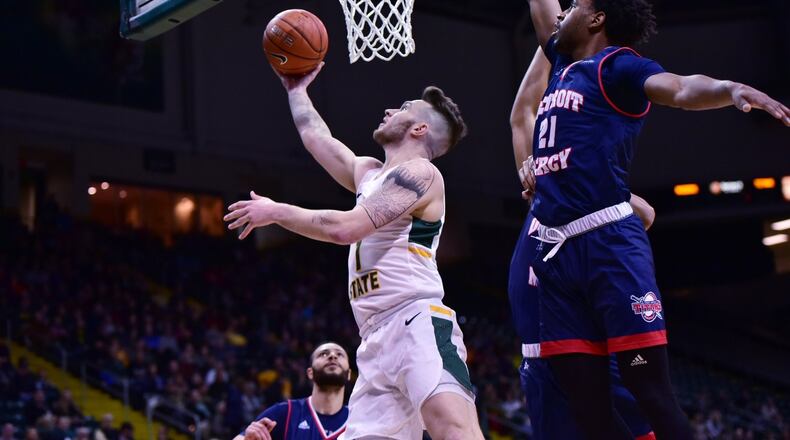Wright State’s Bill Wampler scores as Detroit Mercy’s Lamar Hamrick defends during a game this season at the Nutter Center. Joseph Craven/CONTRIBUTED