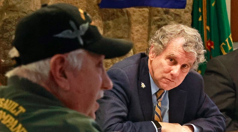 Senator Sherrod Brown listens to veteran Steve Ratcliffe during a round table discussion between Sen. Brown and local veterans Wednesday, Jan. 11, 2023, at VFW Post 1031 in Springfield. BILL LACKEY/STAFF