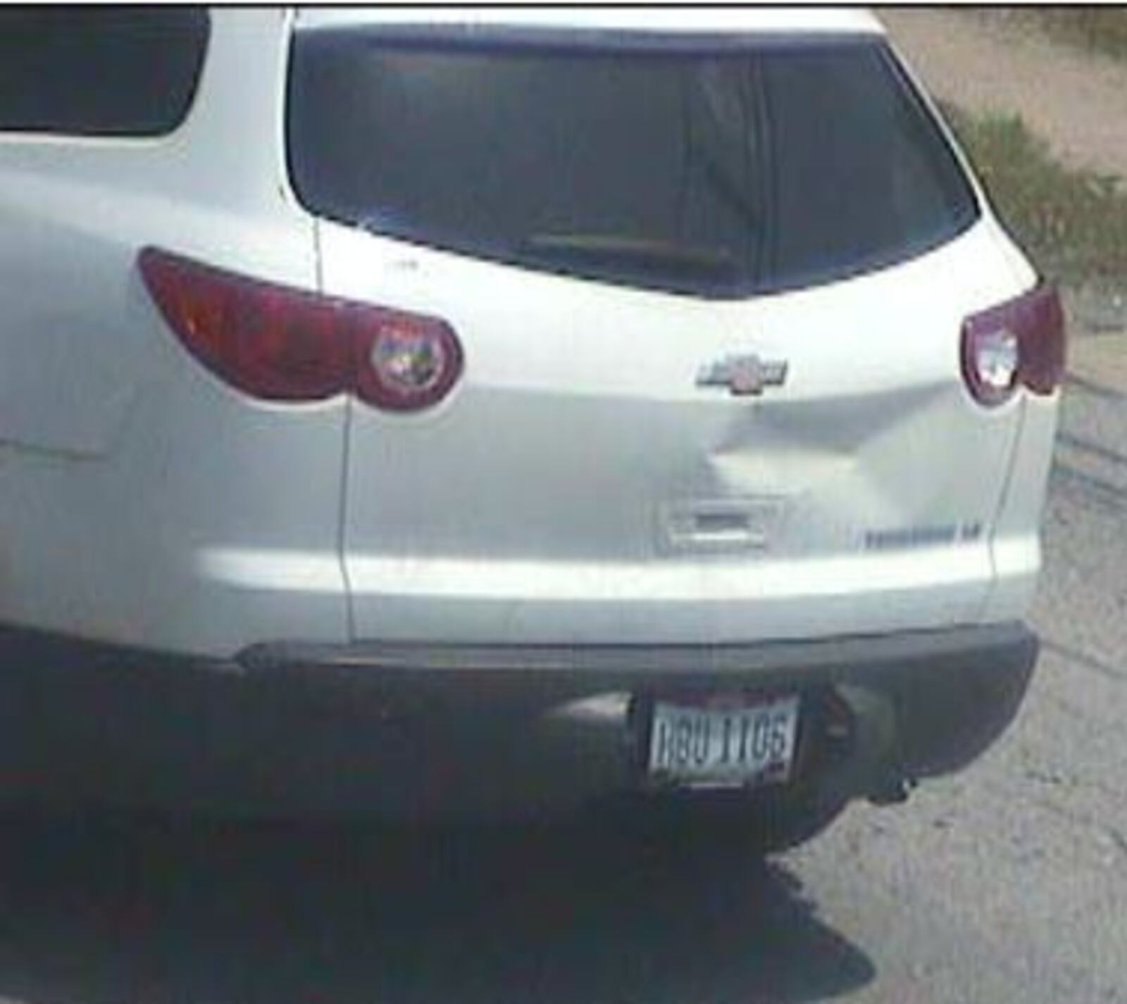 2012 white Chevy Traverse, OH plate HBU1106