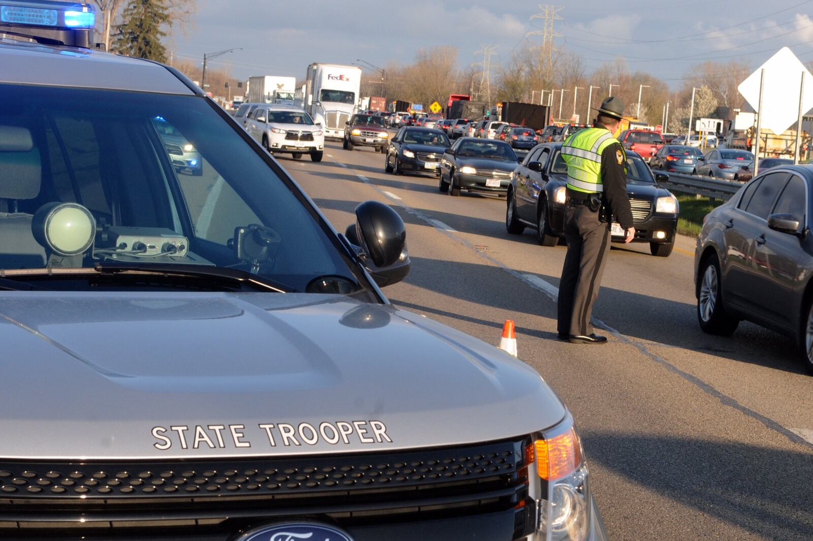 A crash on Route 35 on Tuesday morning, April 5, has rekindled debate over eliminating intersections along a stretch of the highway in Beavercreek Twp. Some say installing overpasses instead would help reduce accidents in the area. MARSHALL GORBY/STAFF