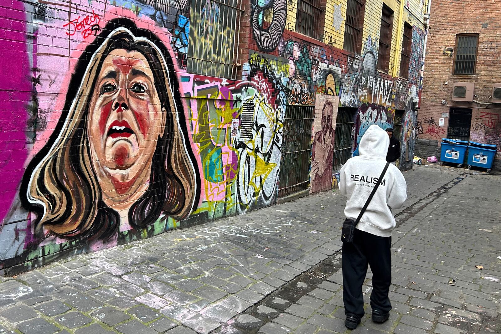 A likeness of Erin Patterson is painted on a wall in Melbourne, Australia, on June 28, 2025. (AP Photo/Rod McGuirk)