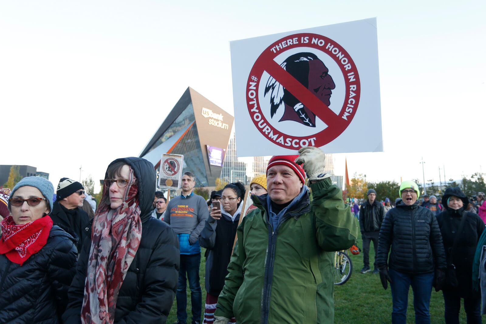 FILE - Native American leaders protest against the Redskins team name and logo outside U.S. Bank Stadium before an NFL football game between the Minnesota Vikings and the Washington Redskins in Minneapolis on Oct. 24, 2019. (AP Photo/Bruce Kluckhohn, File)